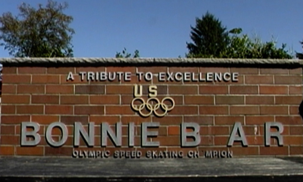 A wide shot of a monument to Bonnie Blair.